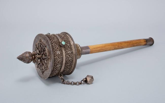 Handheld Prayer Wheel; Central Tibet; early 20th century; Silver, wood; Rubin Museum of Art, gi…